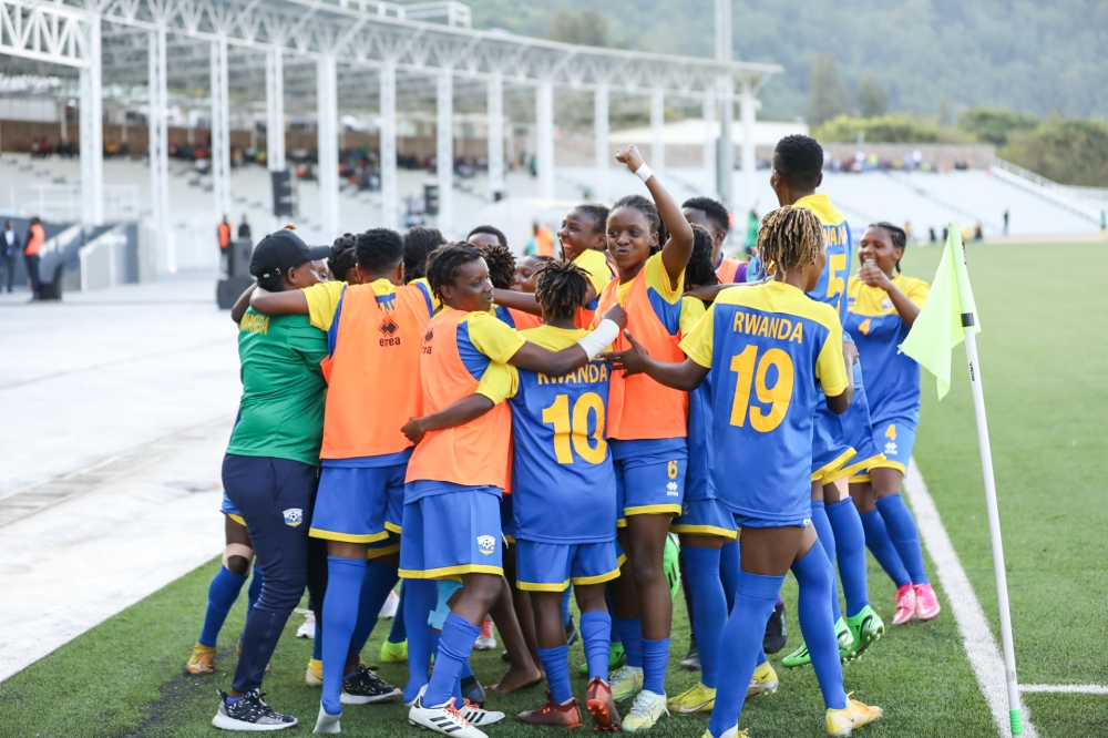 Amavubi women&#039;s team players celebrate after a 3-3 draw against Uganda at Kigali Pele Stadium. All Photos by Dan Gatsinzi