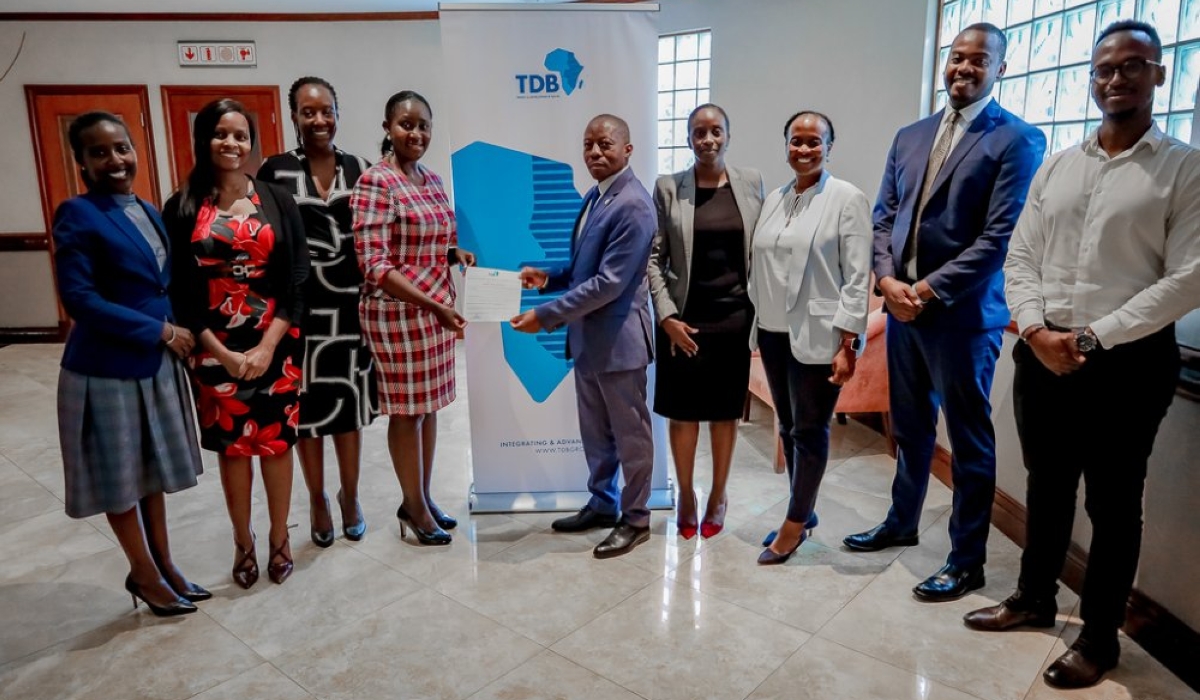 The CEO of Agaciro Development Fund, Gilbert Nyatanyi, with the Group Executive Corporate Affairs and Investor Relations of TDB, Mary Kamari, during the announcement of the fund’s $8.1 million investment in the regional bank. PHOTO BY IGIHE