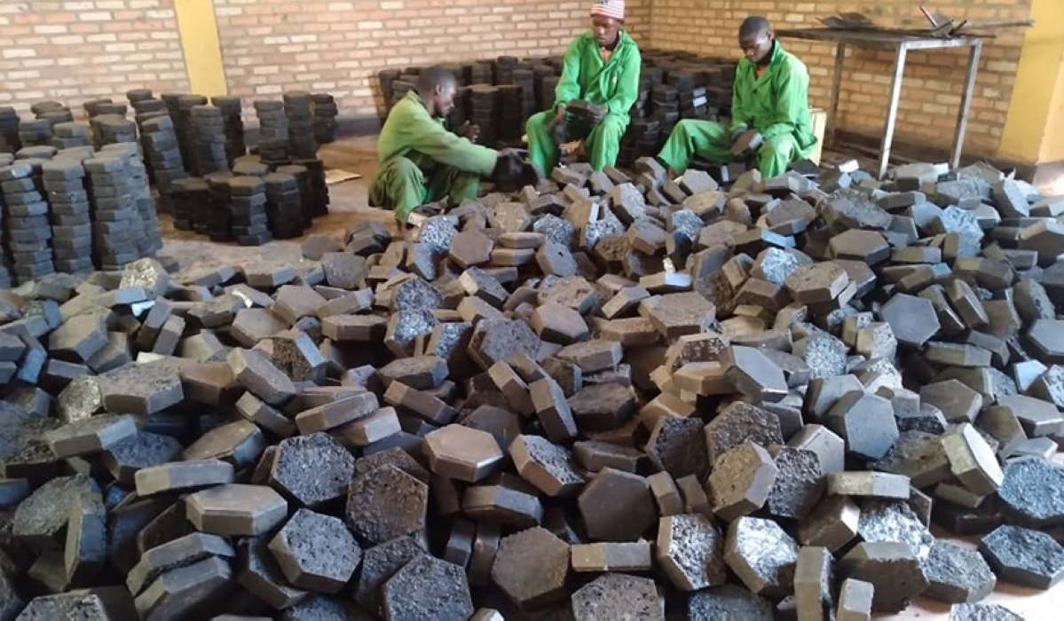 Workers sort some pavers made from plastic waste at Green Care Rwanda Ltd, Huye District based company.