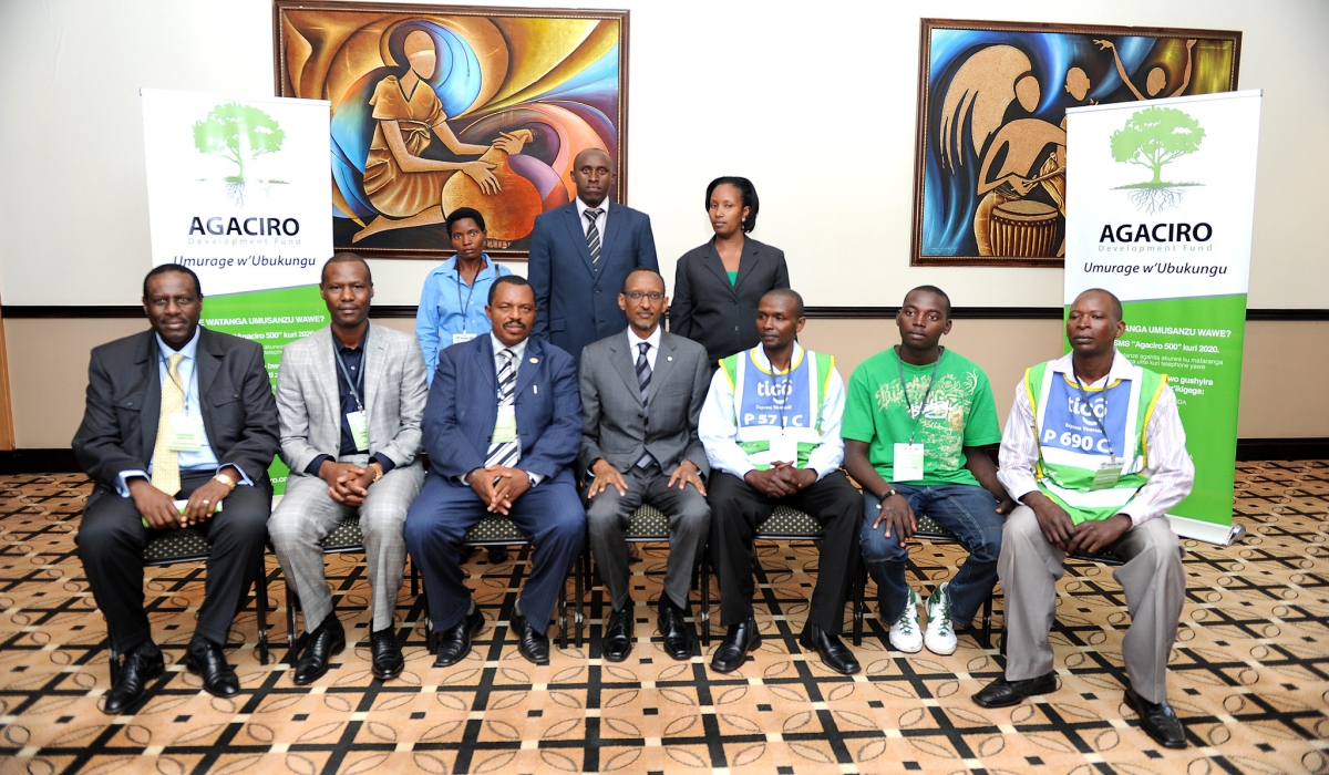 President Paul Kagame  poses for a photo with some delegates during the launch of Agaciro Development Fund in Kigali, on August  23, 2012. File 