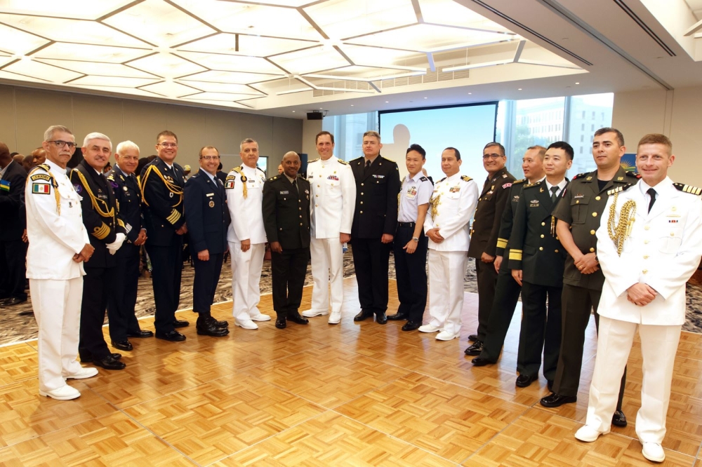 Representatives of military attaché who joined Rwandans in Canada at the ceremony, pose for a group photo at the event
