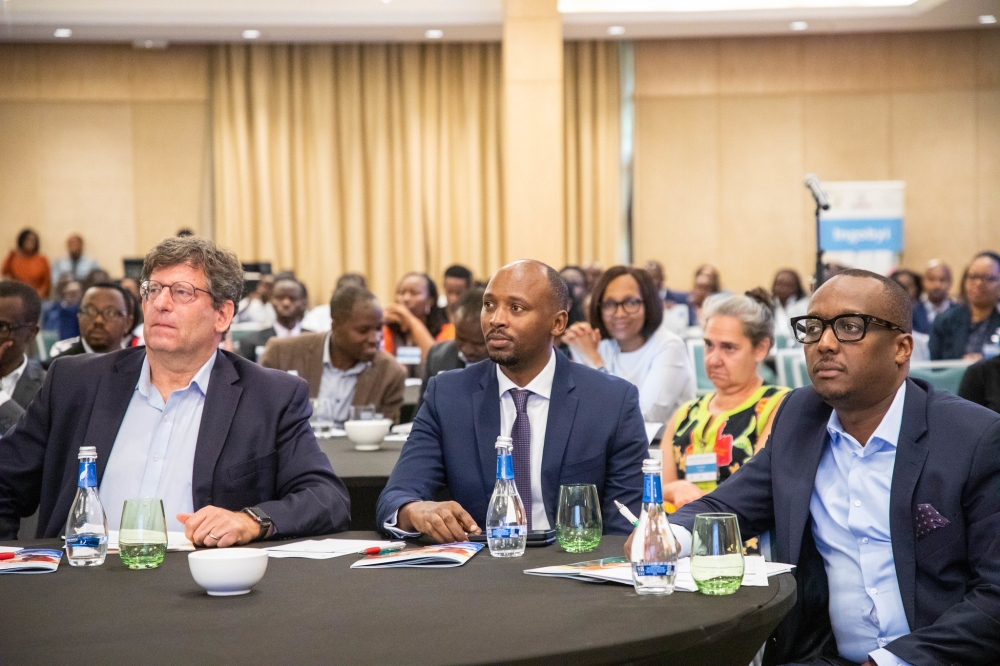 Minister of Health Sabin Nsanzimana (C) with other delegates follow a presentation during the event. Minister of Health Sabin Nsanzimana (C) with other delegates follow a presentation during the event.