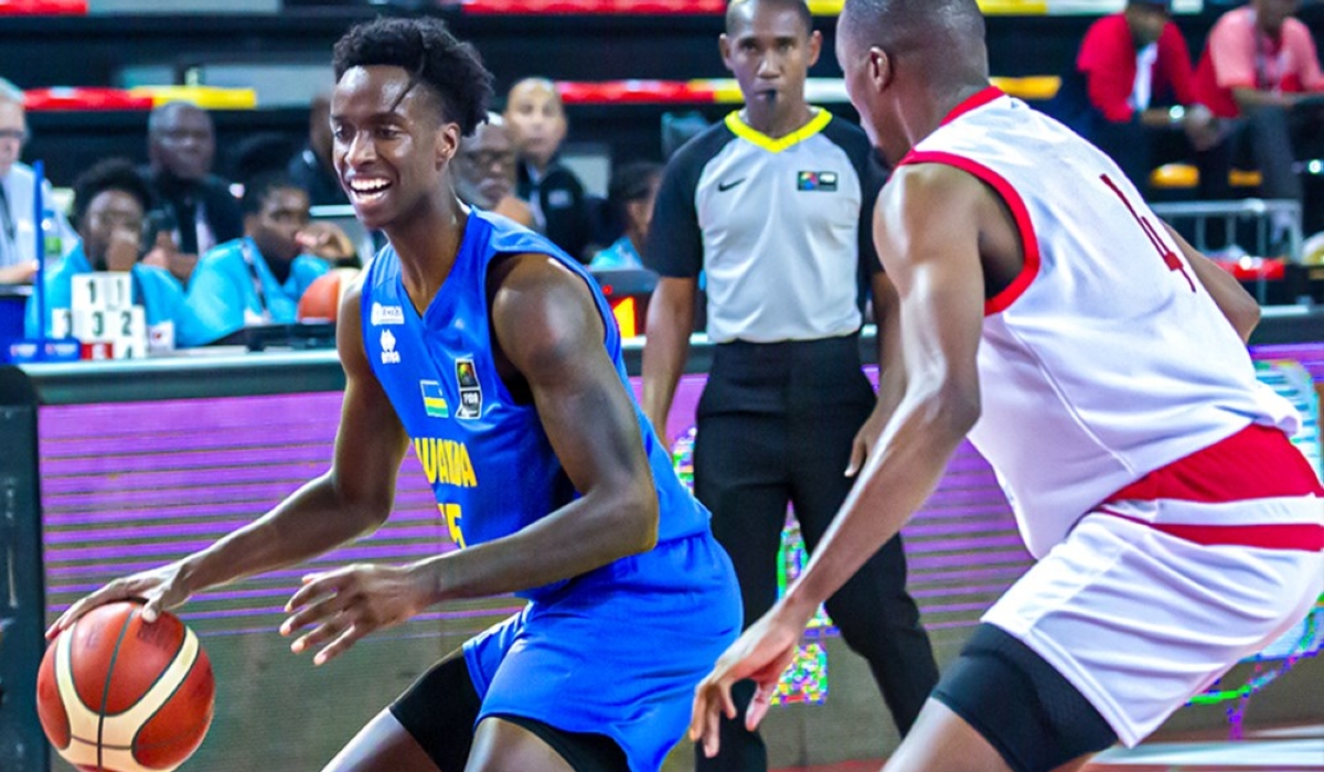 National team&#039;s s Ntore with the ball during the game when they booked a quarter finals berth in the 2023 FIBA AfroCAN after a 73-62 victory over Mozambique on July 12. COURTESY