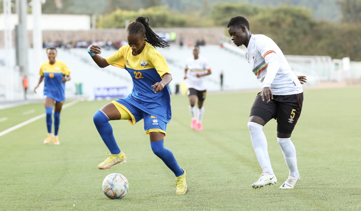 Rwanda&#039;s Kayitesi tries to go past a Ugandan defender  during their 3-3 draw against Uganda in the first leg of the Paris 2024 Games qualifiers at Kigali Pele Stadium on Wednesday