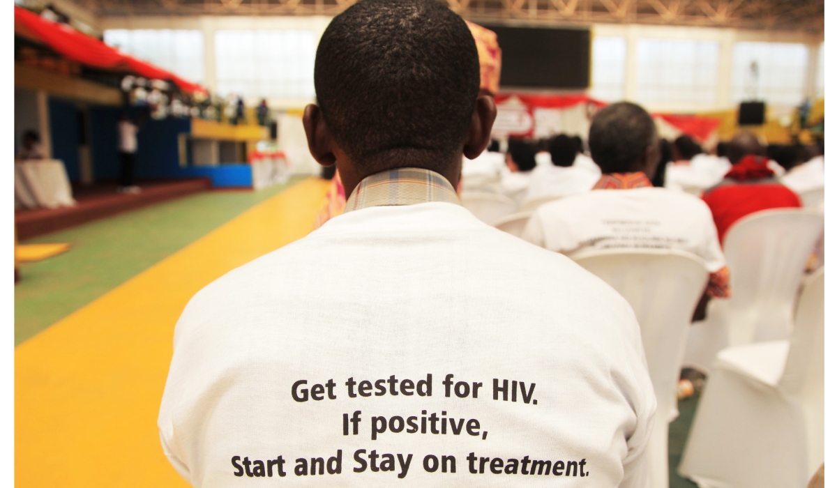 A participant follows the proceedings of AIDS Day in Kigali .UNAIDS has recognized Rwanda as one of the top four countries that have effectively managed the HIVAIDS epidemic. File