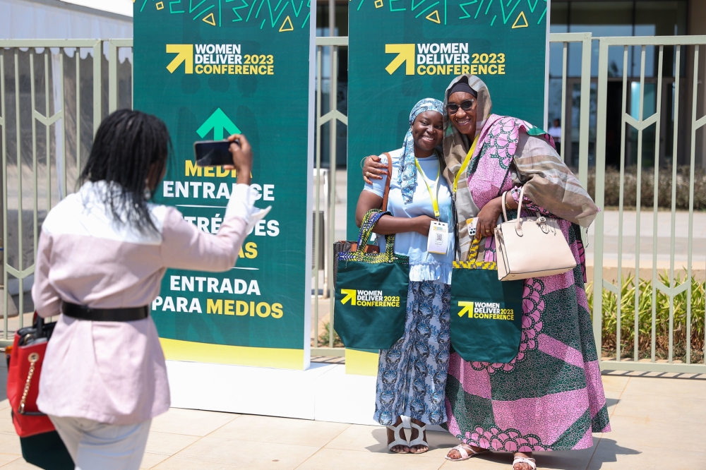 Some of over 6000 delegates expected to attend the 2023 Women Deliver Conference  in Kigali. Seen here take pictures after receiving their badges on Saturday, July 15. OLIVIER MUGWIZA