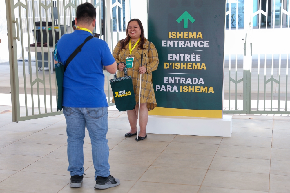 A delegate takes a picture of his mate. The conference  will be held under the theme: "Spaces, Solidarity, and Solutions".