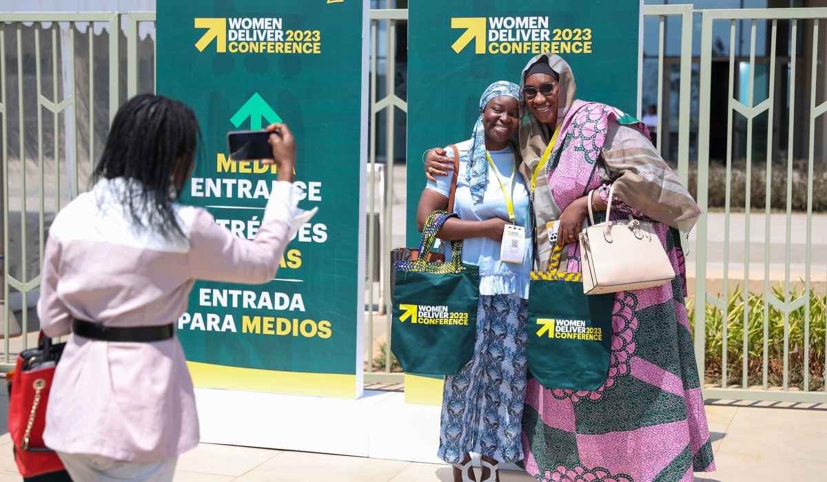 Some of over 6000 delegates expected to attend the 2023 Women Deliver Conference  in Kigali. Seen here take pictures after receiving their badges on Saturday, July 15. OLIVIER MUGWIZA