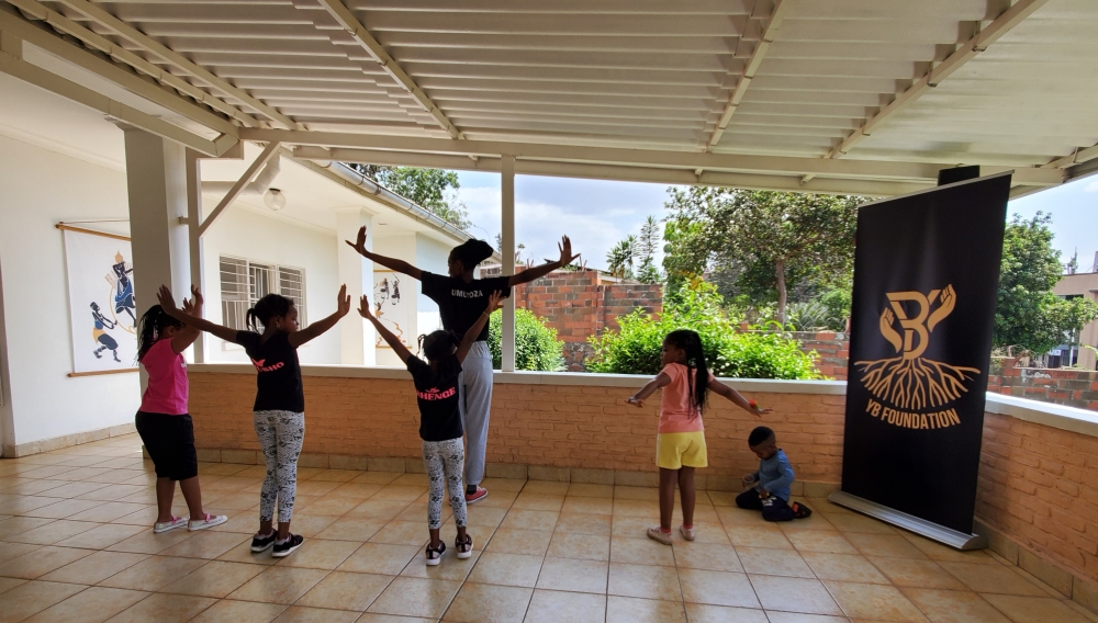Children learning traditional dance moves at the academy