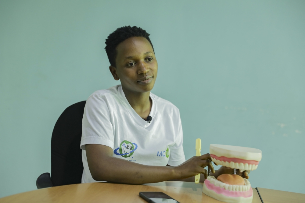 A dental therapist, 26-year-old, Esperance Niyigena during an interview. She has observed how difficulties in communication and language barriers can impede individuals from accessing or delivering services. Emmanuel Dushimimana