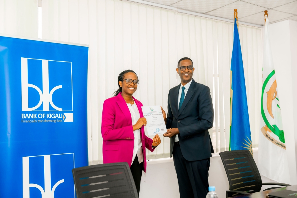Bank of Kigali Chief Executive Officer, Dr. Diane Karusisi and Col. David Kanamugire, CEO of The National Cybersecurity Authority (NCSA), during the handover ceremony. COURTESY PHOTOS
