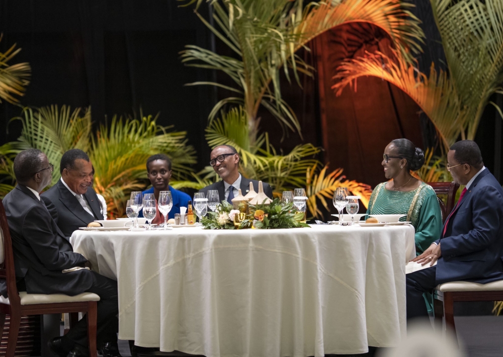 President Paul Kagame and First Lady, Jeannette Kagame, sharing a light moment with President Sassou-Nguesso at a State Banquet President Paul Kagame and First Lady, Jeannette Kagame, sharing a light moment with President Sassou-Nguesso at a State Banquet