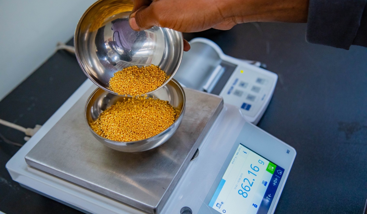 A worker weighs  gold for export at Gold Refinery in Rwanda on  June 18, 2019. According to the Rwanda Mines, Petroleum, and Gas Board, Gold exports raked in more than $302 million. File