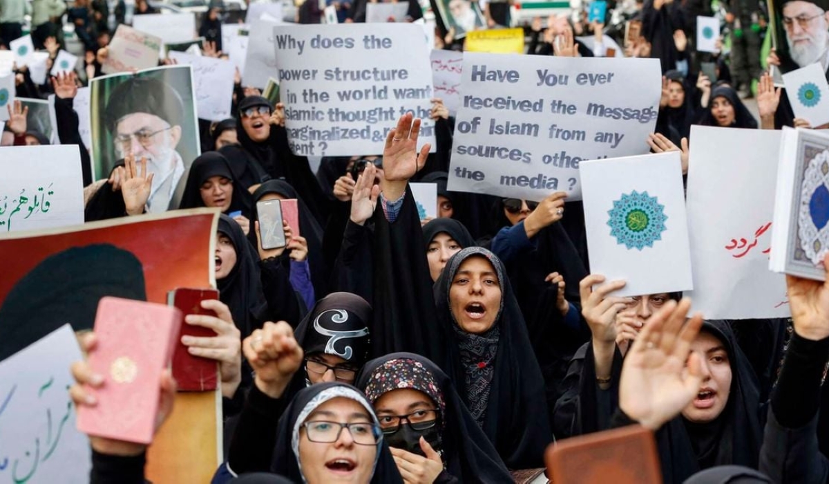 Students lift placards and chant slogans during a demonstration denouncing the burning of the Quran in Sweden, Islam&#039;s holy book, in front of Swedish embassy in Tehran, Iran on July 21. PHOTO: AFP