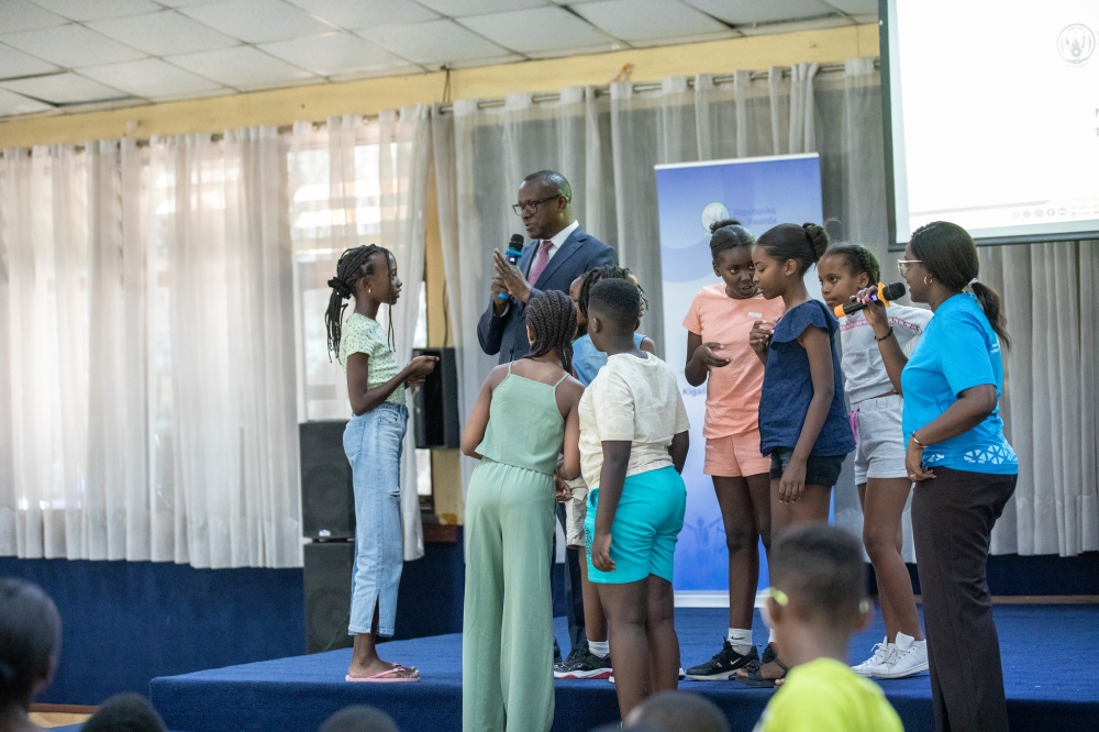 Jean-Damascène Bizimana, the Minister in the Ministry of National Unity and Civic Engagement  interacts with children from Diaspora, on Wednesday, July 26. All photos by Dan Gatsinzi