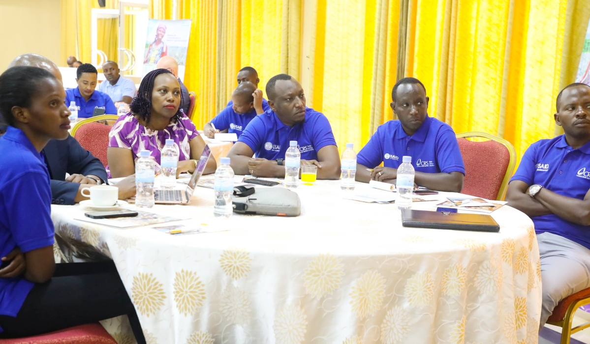 Participants follow a presentation during the closing event of the project. The training focused on increasing horticulture farmers&#039; productivity using organic fertilizers and implementing cost-effective techniques. Photos by Craish BAHIZI