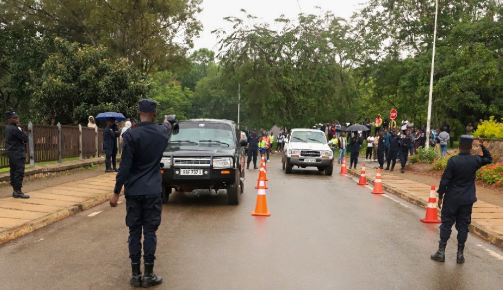 Traffic police officers invigilate a driving test exam in Kigali. The government is nearing the completion of plans to implement automatic driving tests and issue related licenses. COURTESY