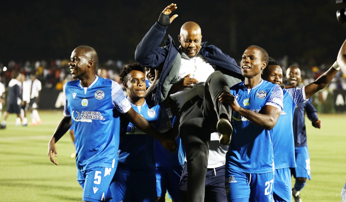 AS Kigali players lift up the head coach Andre Casa Mbungo at Kigali Pele Stadium on June 28, 2022. Craish BAHIZI