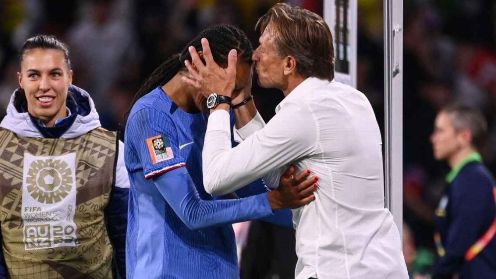 France coach Hervé Renard kisses winning goal scorer Wendie Renard at full time. Frack FIFE/ AFP via Getty Images 