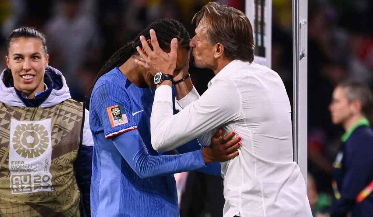 France coach Hervé Renard kisses winning goal scorer Wendie Renard at full time. Frack FIFE/ AFP via Getty Images 