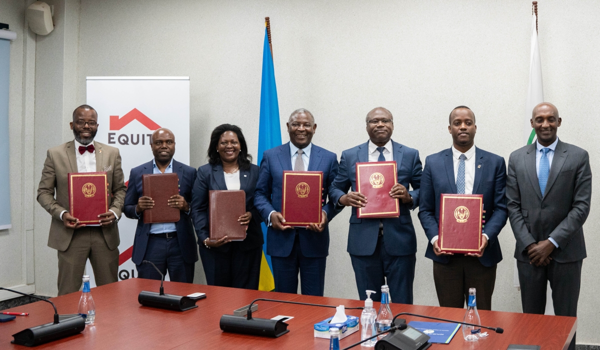 Minister of Finance and Economic planning Dr Uzziel Ndagijimana and James Mwangi, the Equity Group Managing Director and CEO  with other officials pose for a group photo during the event  in which Equity Group completed the acquisition of 91.9 percent shares in Cogebanque at a cost of $55 million, making it the majority shareholder in the Rwandan bank, in Kigali on July 28, Courtesy