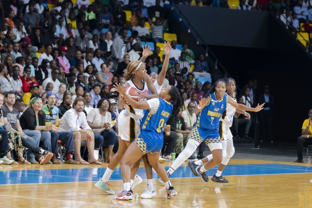 Angolan players battle for the ball with Rwandan defenders during the game at BK Arena on Sunday, July 30. All photos by Christianne Murengerantwari.