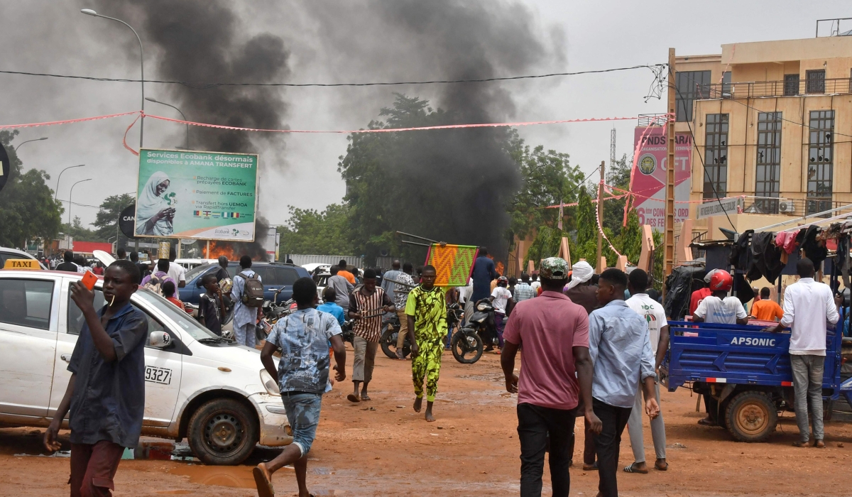 A general view of billowing smoke as supporters of the Nigerien defence and security forces attack the headquarters of the Nigerien Party for Democracy and Socialism (PNDS), the party of overthrown President Mohamed Bazoum, in Niamey on July 27, 2023. (Photo by AFP) (Photo by -/AFP via Getty Images)