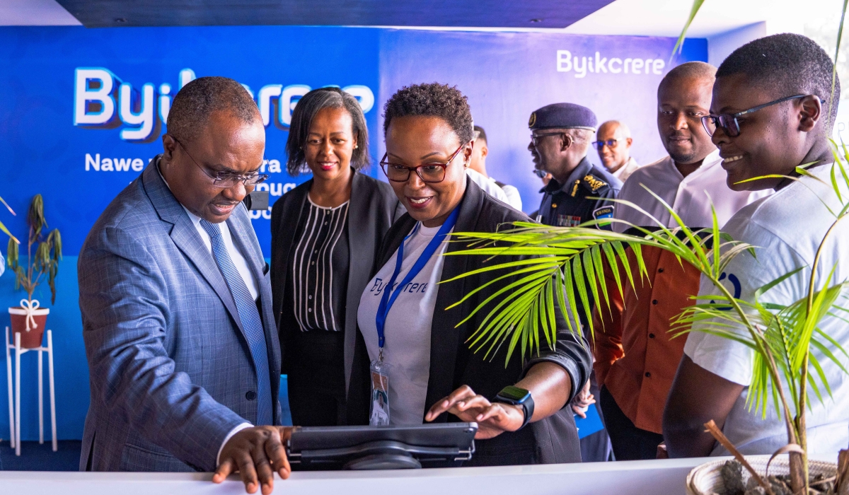 Minister of Trade ,Jean Chrysostome Ngabitsinze visits Irembo stand at the Intenational Trade Fair after the official inauguration on Monday, July 31.