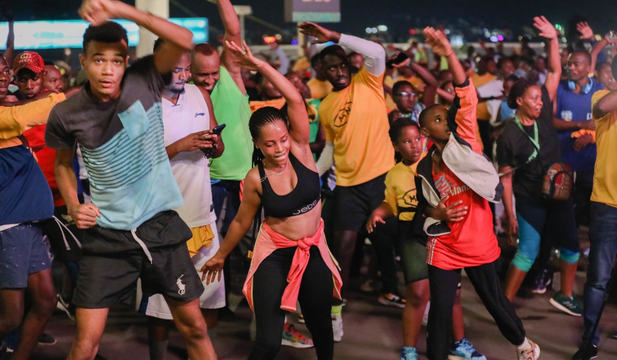 Kigali residents stretch, at BK Arena, before taking part in Kigali Night Run in June last year. Photo: Craish Bahizi.