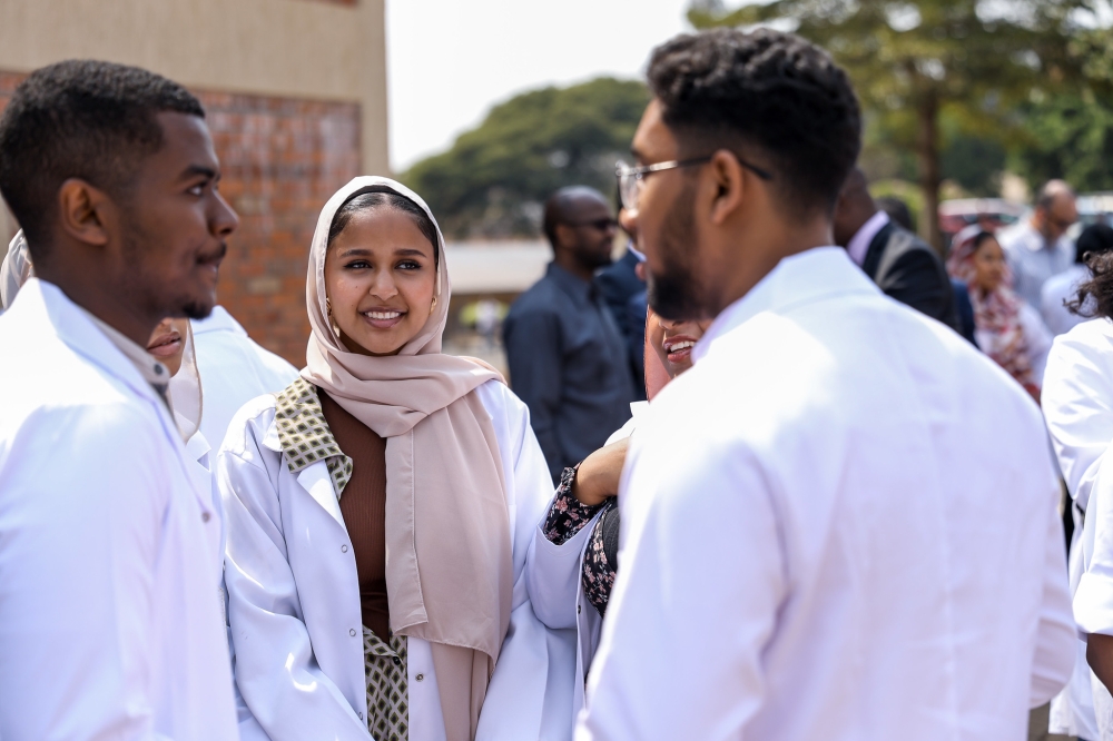 Some of the 160 students from Sudan chat at a reception held to welcome them to Rwanda, on Wednesday, August 2. The students from the University of Medical Sciences and Technology in Khartoum who had been stranded and unable to complete their studies owing to the current security crisis in Sudan are in Rwanda to continue their studies at the University of Rwanda (UR) - School of Medicine and Health Sciences. Photos by Olivier Mugwiza