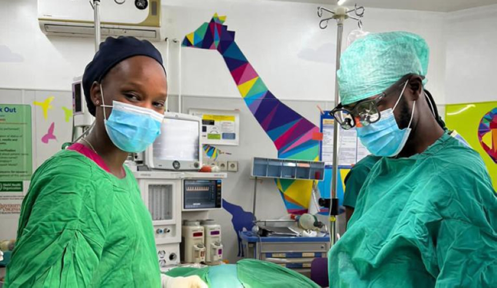 Dr Axwlle Nduwimana in an operation room preparing for surgery.