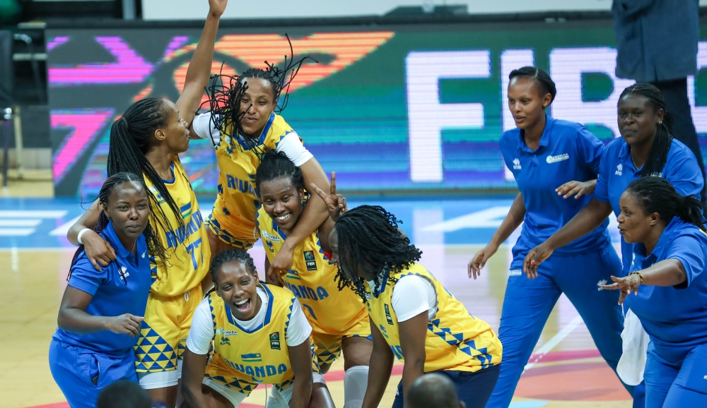 National Basketball team players celebrate the victory. Rwanda qualified for the semifinals of the FIBA Women’s Afrobasket after beating Uganda 66-61 in a tense quarterfinal clash held at BK Arena on Wednesday night. PHOTOS BY Dan Gatsinzi Kwizera