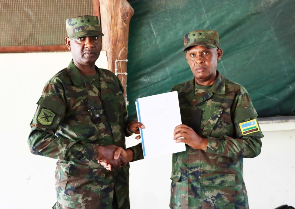 Outgoing Rwanda Security Forces' Force Commander Maj. Gen. Eugene Nkubito (right) handed over to new Force Commander Maj. Gen. Alex Kagame (left), on Friday,  August 4, 2023, in Mocimboa da Praia.