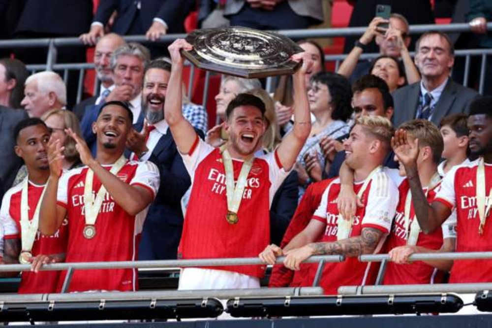 Arsenal players celebrate the Community Shield after beating Manchester City in penalty shootouts-Getty Images