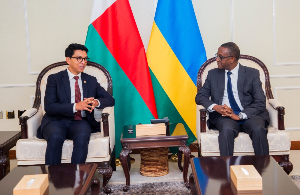 Madagascar President Andry  Rajoelina interacts with Dr Vincent Biruta, Minister of Foreign Affairs and International Cooperation on his arrival at Kigali International Airport, on Sunday, August 6. PHOTO BY Cyrill Ndegeya