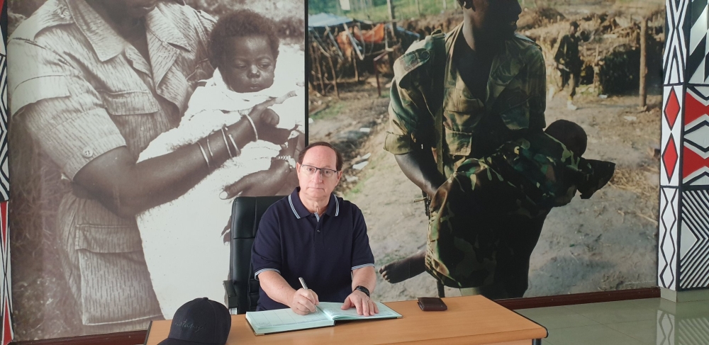 Ambassador Rom Adam signs the book of visitors during his tour of the Museum of the Campaign Against Genocide  on August 6, to pay tribute to the fighters who liberated Rwanda. Courtesy
