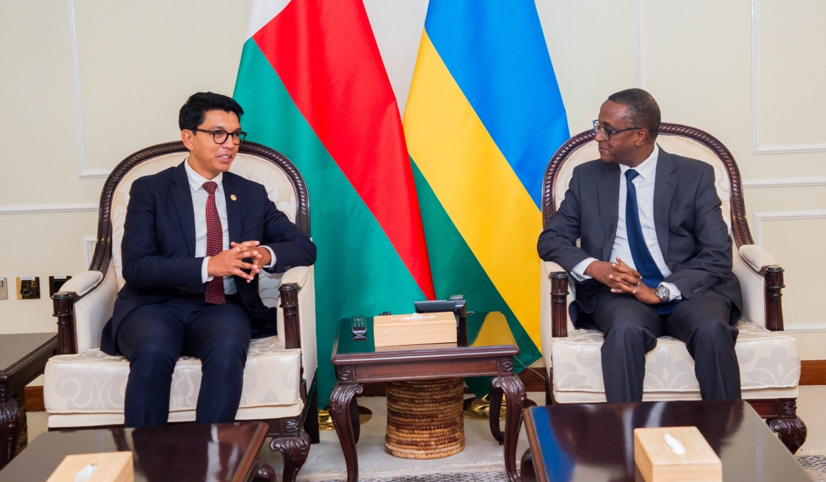 Madagascar President Andry  Rajoelina interacts with Dr Vincent Biruta, Minister of Foreign Affairs and International Cooperation on his arrival at Kigali International Airport, on Sunday, August 6. PHOTO BY Cyrill Ndegeya