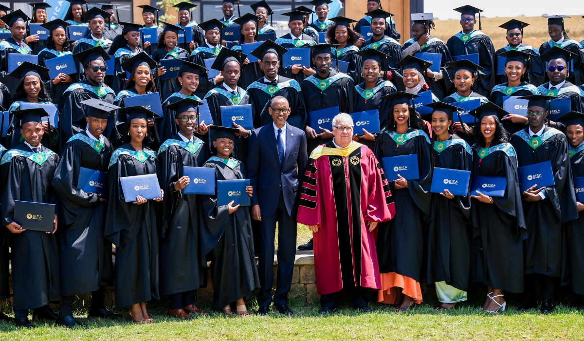 President Paul Kagame poses for a photo with Howard Buffet, the founder of Rwanda Institute for Conservation Agriculture
(RICA) and 75 graduates of the first-ever graduation ceremony at RICA in Bugesera District on Tuesday, August 8. While
addressing graduates, Kagame has challenged them to introduce innovative solutions to spur the needed growth. Photos: Olivier Mugwiza.