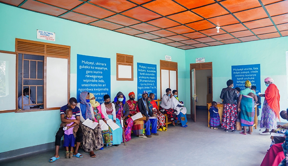 Patients wait for medical services in Burera District. The number of vulnerable households eligible for support by the government was slashed by 74.4 per cent from 450,000 to 115,000 in  fiscal year.  File