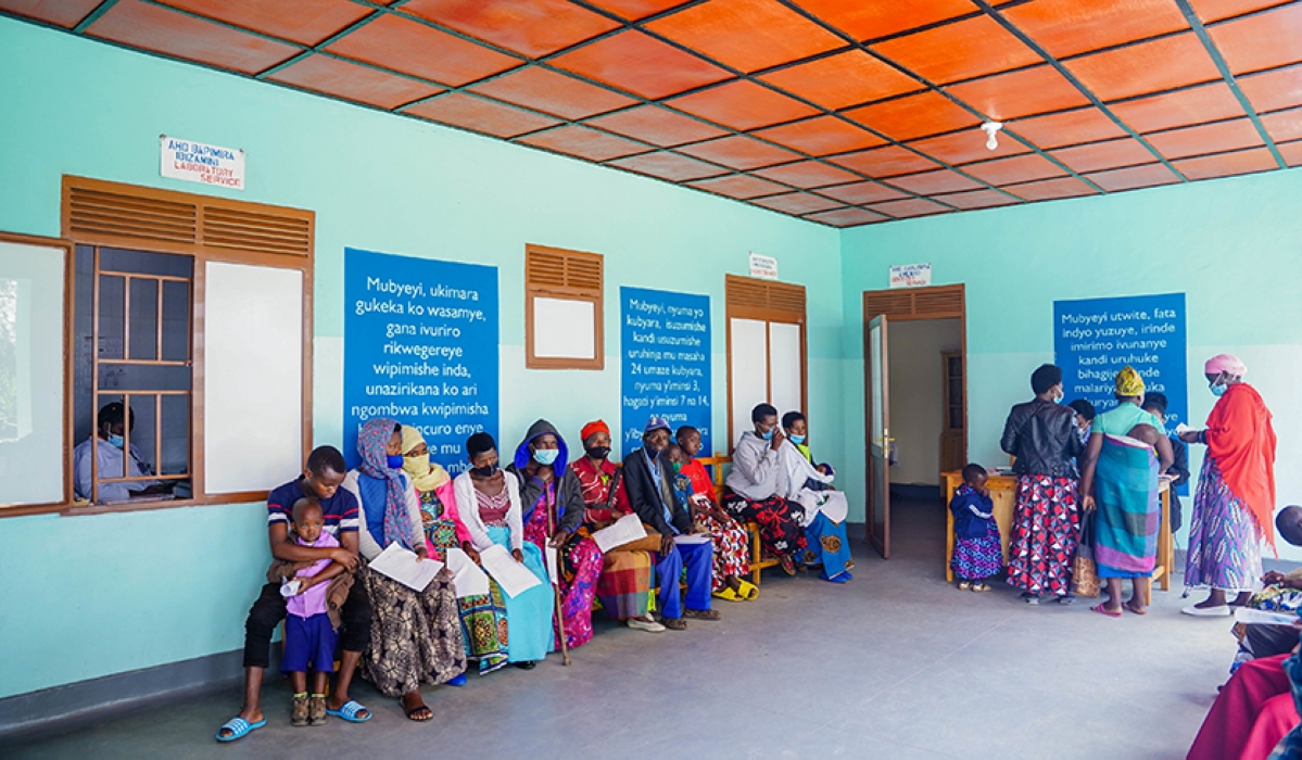 Patients wait for medical services in Burera District. The number of vulnerable households eligible for support by the government was slashed by 74.4 per cent from 450,000 to 115,000 in  fiscal year.  File
