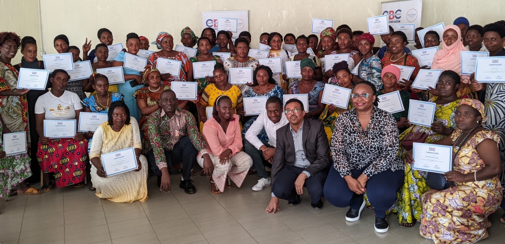 Participants  pose for a group photo with their certificates after completing a three-day training on how to embrace digital payment as part of their daily business. Photos by Germain Nsanzimana 