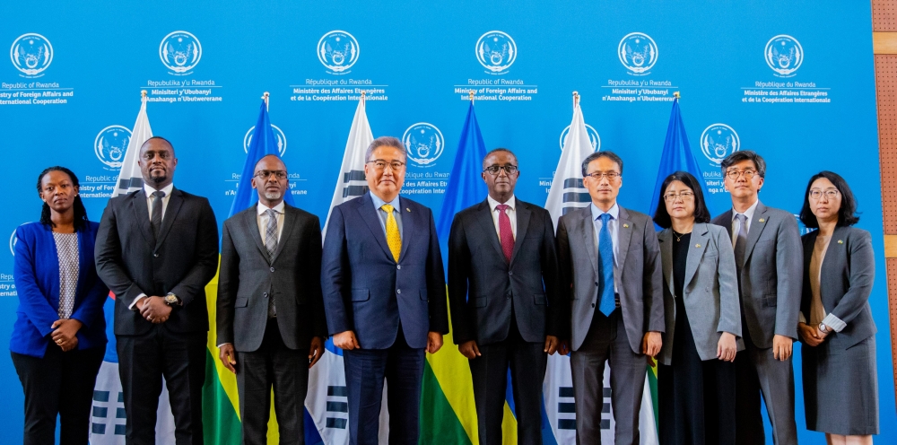 Both delegations pose for a group photo after signing the agreements in Kigali on August 12. Courtesy