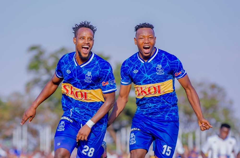 Rayon Sports midfielder Rashid Kalisa (L) with defender Aimable Nsabimana celebrate Kalisa&#039;s goal as the Blues shocked rivals APR FC 3-0 to win the 2023 Super Cup title on Saturday, August 12. Courtesy