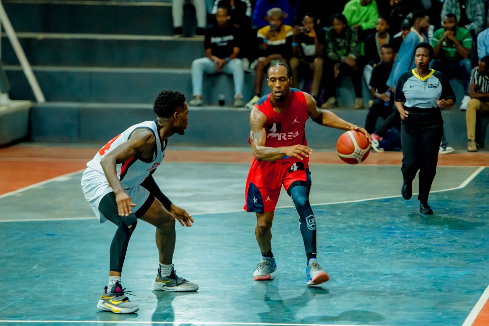 REG&#039;s Star point guard Adonis Filer tries to go past Patriots&#039; player  during Sunday night game at Lycee de Kigali. Courtesy