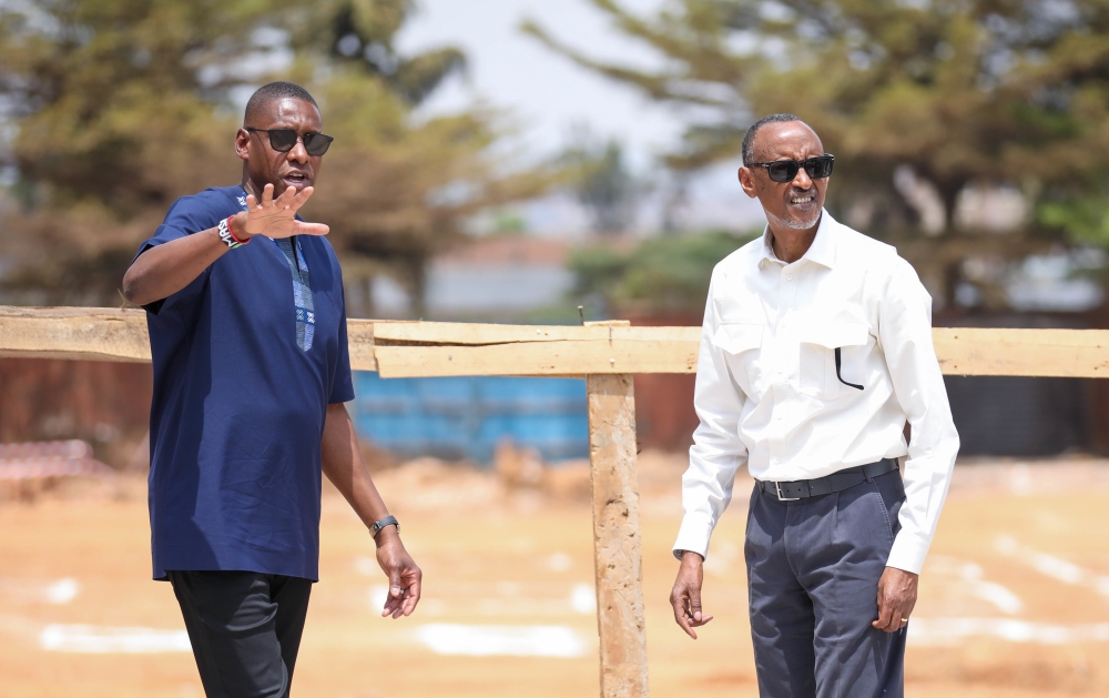 President Paul Kagame interacts with  Masai Ujiri, Toronto Raptors president and vice-chair and Giants of Africa co-founder   during the official groundbreaking ceremony of “Zaria Court Kigali” in Remera, on Monday, August 14.