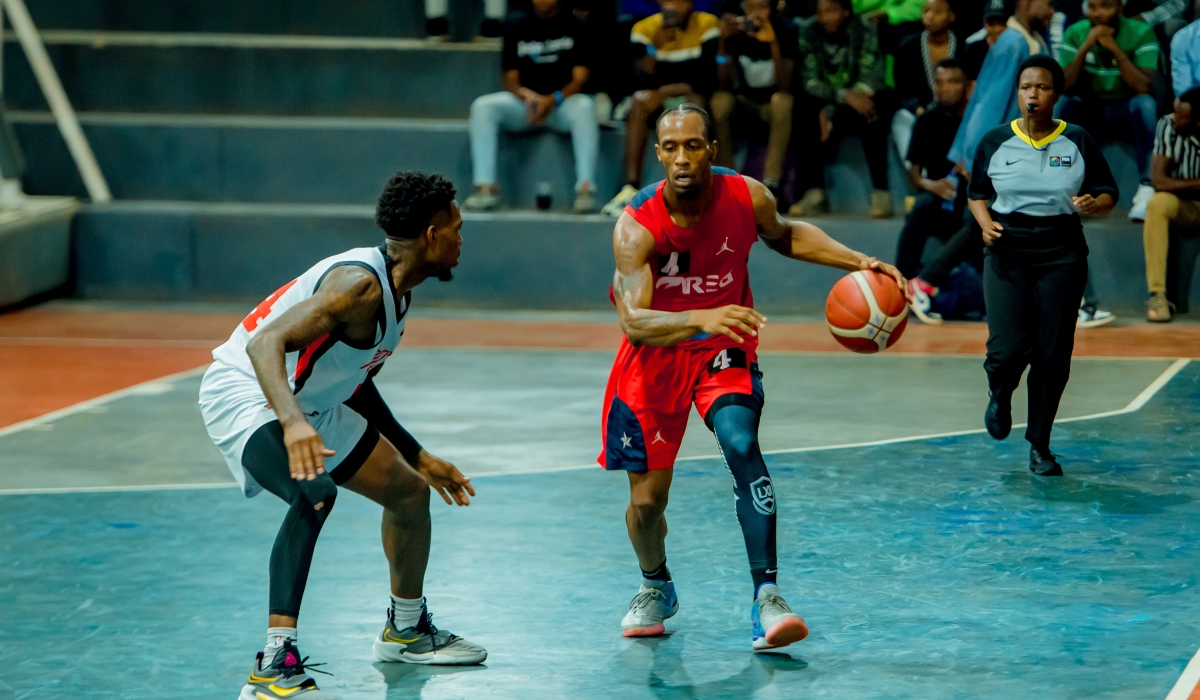 REG&#039;s Star point guard Adonis Filer tries to go past Patriots&#039; player  during Sunday night game at Lycee de Kigali. Courtesy