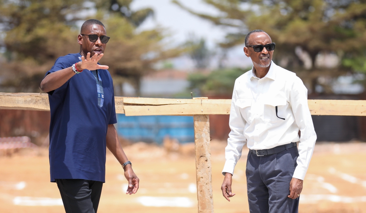 President Paul Kagame interacts with  Masai Ujiri, Toronto Raptors president and vice-chair and Giants of Africa co-founder   during the official groundbreaking ceremony of “Zaria Court Kigali” in Remera, on Monday, August 14.