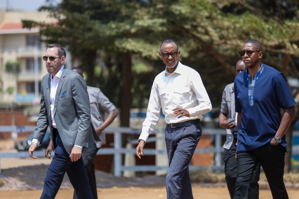President Paul Kagame, Masai Ujiri, Toronto Raptors president and vice-chair and Giants of Africa co-founder (R) and and Andrew Feinstein, the project’s co-sponsor(L) with delegates during a tour at the official groundbreaking ceremony of the “Zaria Court Kigali" on Monday, August 14. Photos by  Dan Gatsinzi