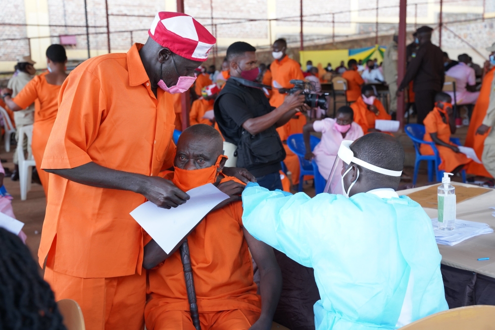 Prisoners undergo a vaccination exercise at Nyarugenge Prison. RIB has arrested  a medic at Nyarugenge prison for offences including  alleged sale of medicine meant to treat inmates. CRAISH BAHIZI