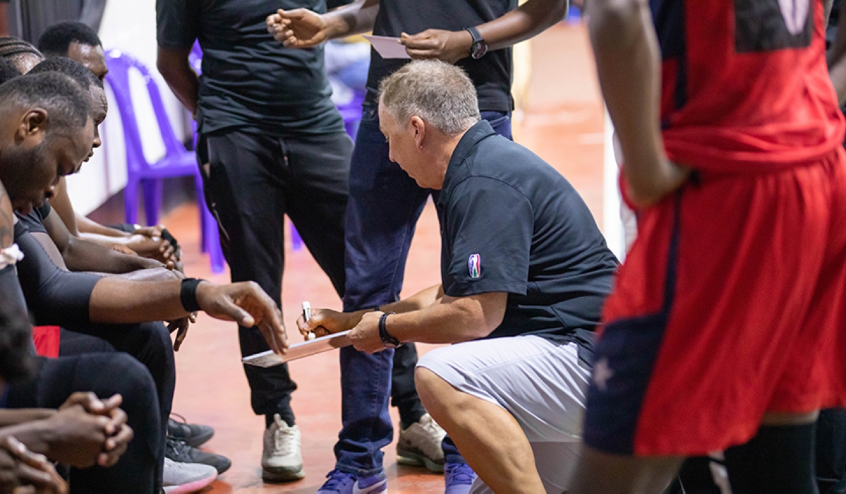 Rwanda Energy Group (REG) head coach Dean Murray gives instructions to the players during a league match against APR BBC. Photo by Dan Gatsinzi